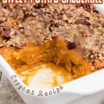 Close up of a corner of Sweet Potato Casserole with a scoop gone. There's text overlay for pinterest.