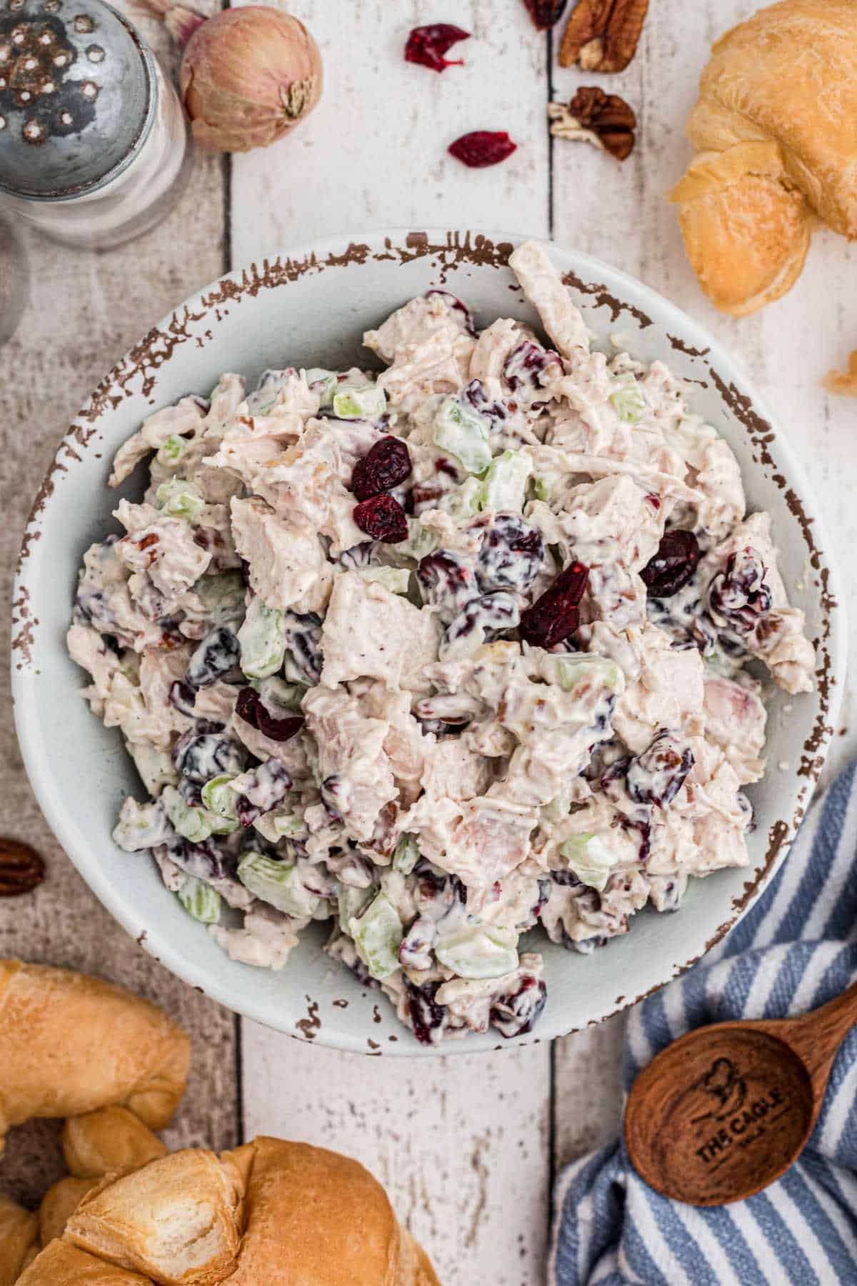 Overhead shot of a bowl of chicken salad with cranberries and pecans.