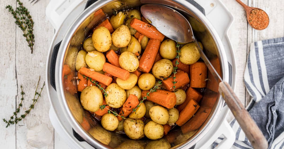 Overhead shot of an Instant pot with potatoes and carrots.
