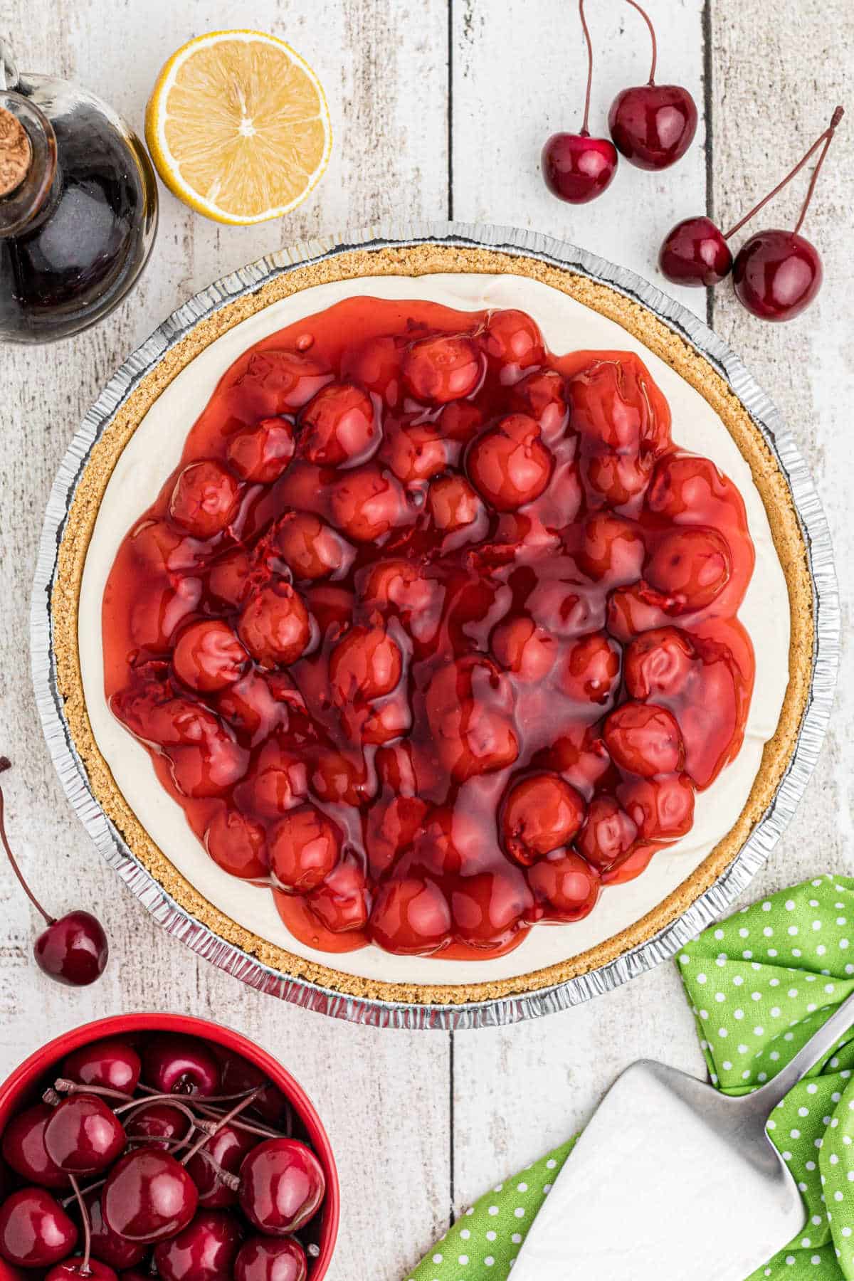 full overhead shot of a no bake cherry pie, surrounded by cherries.