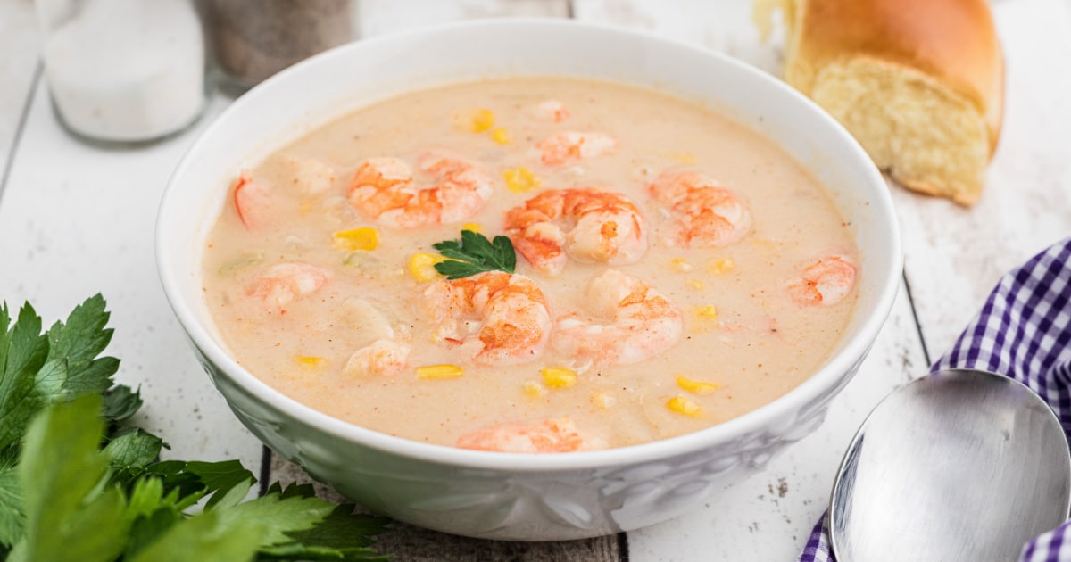 Close up of a bowl of shrimp and corn bisque.