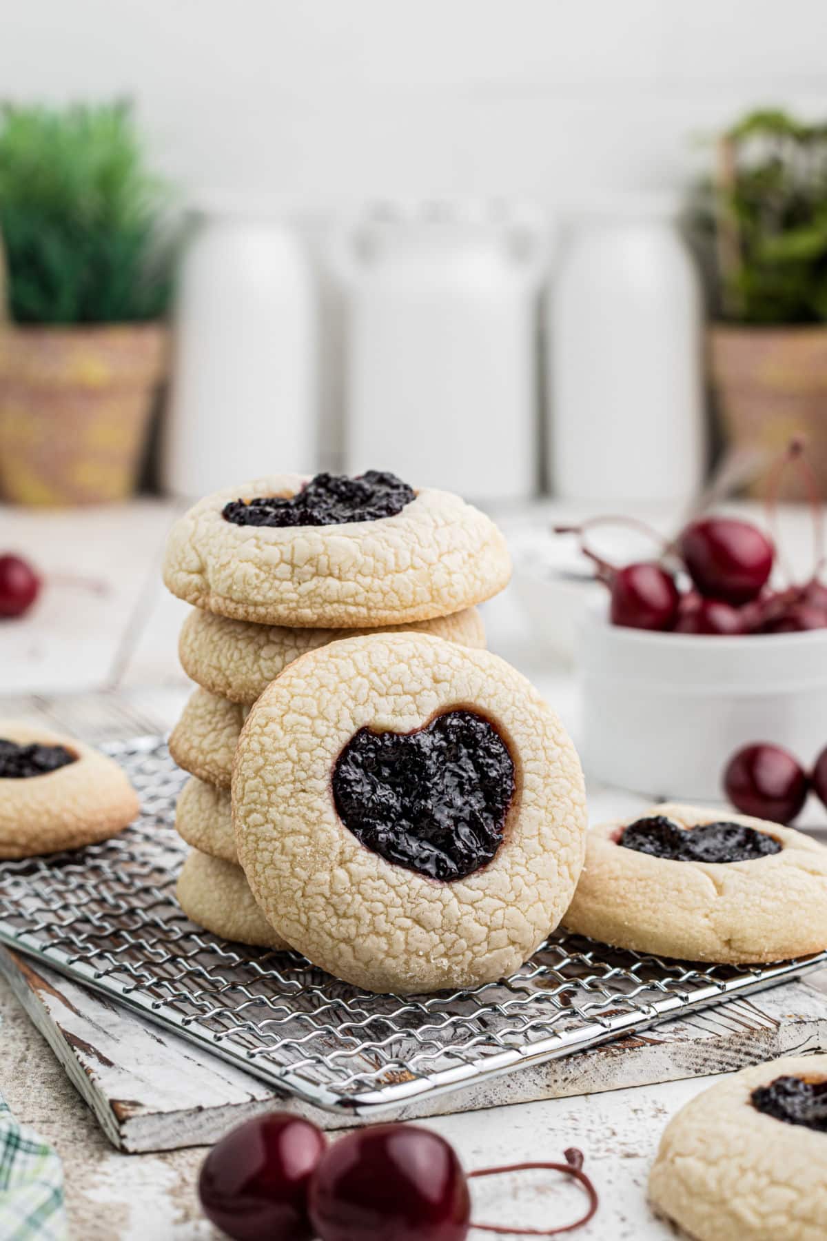 A stack of tiktok jam heart cookies with one standing up leaning against the stack.