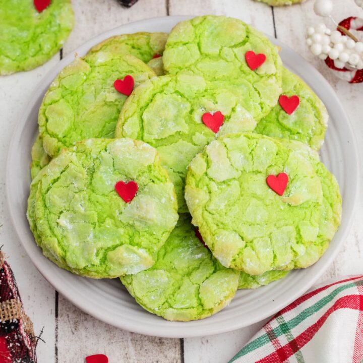 Plate full of green Grinch cookies made with cake mix.