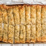 An overhead shot of a pan full of little caesars italian cheese bread recipe.