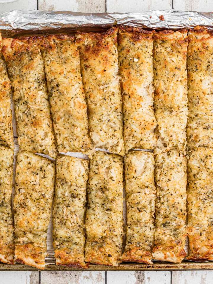 An overhead shot of a pan full of little caesars italian cheese bread recipe.