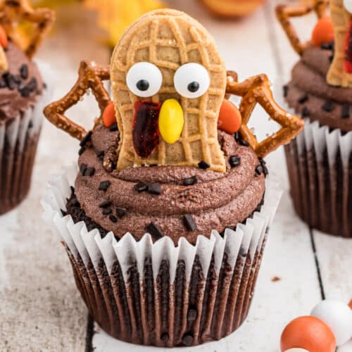 A close up of a turkey cupcake made with nutter butter cookies.