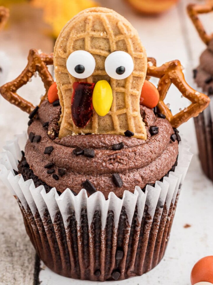 A close up of a turkey cupcake made with nutter butter cookies.