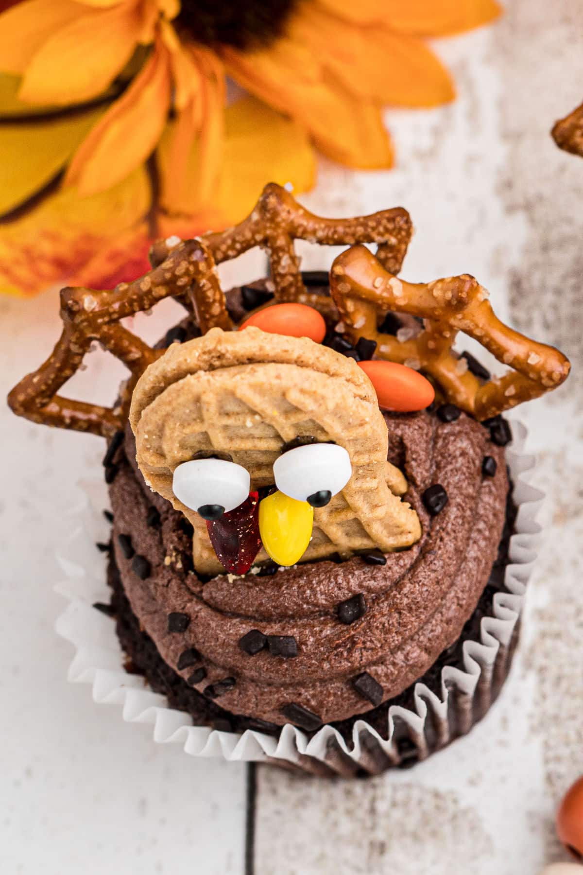 Overhead view of a turkey cupcake made with nutter butter cookies.