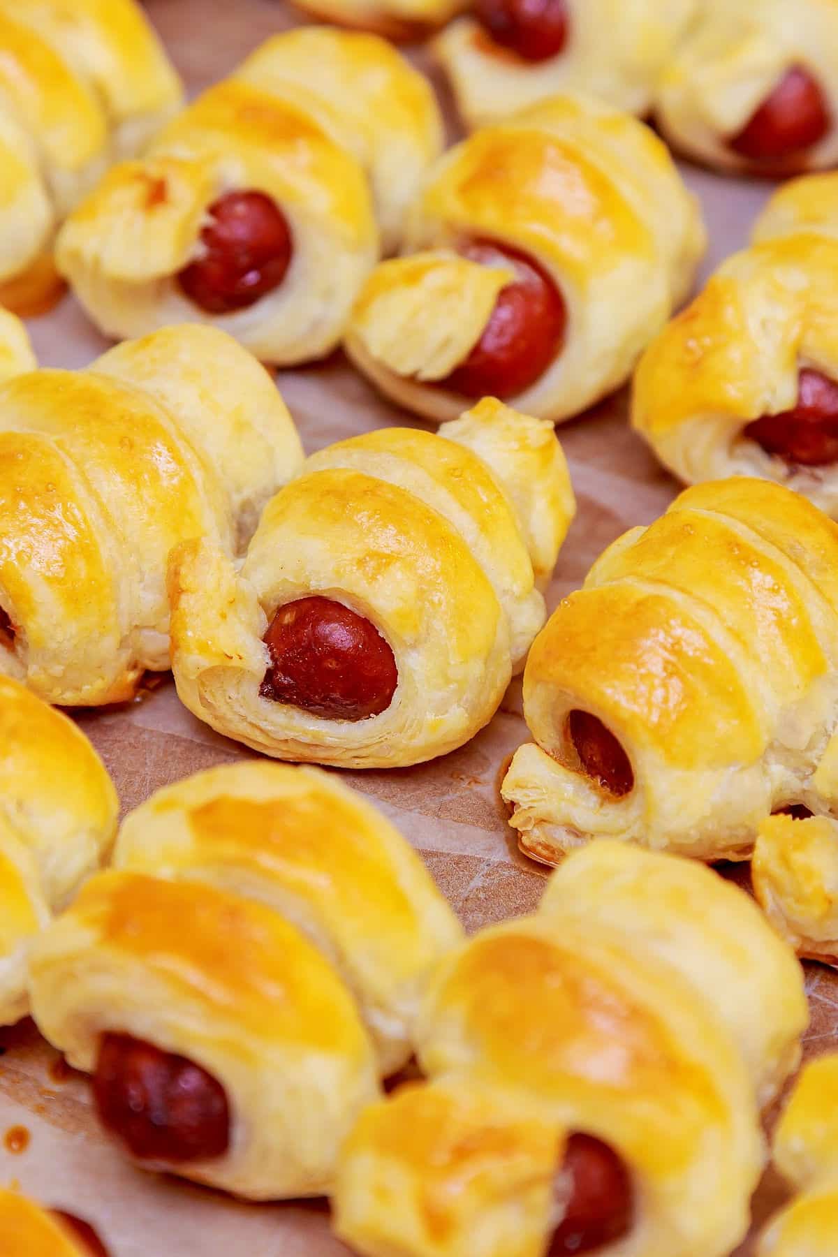 A close up of pigs in blankets.