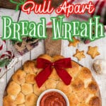 A pull apart bread wreath with text overlay for Pinterest.