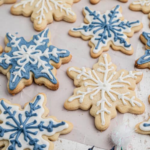 Close up shot of some snowflake cookies cropped square.