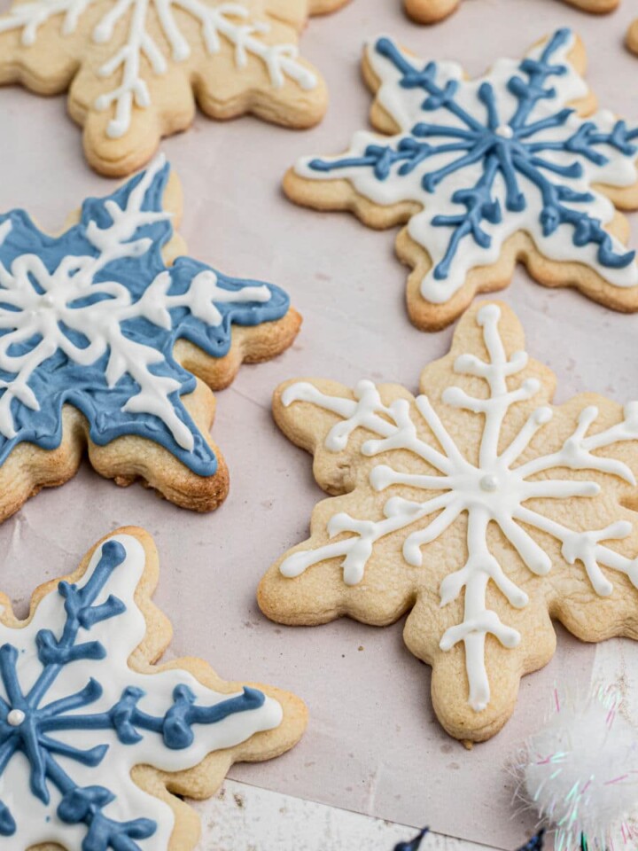Close up shot of some snowflake cookies cropped square.