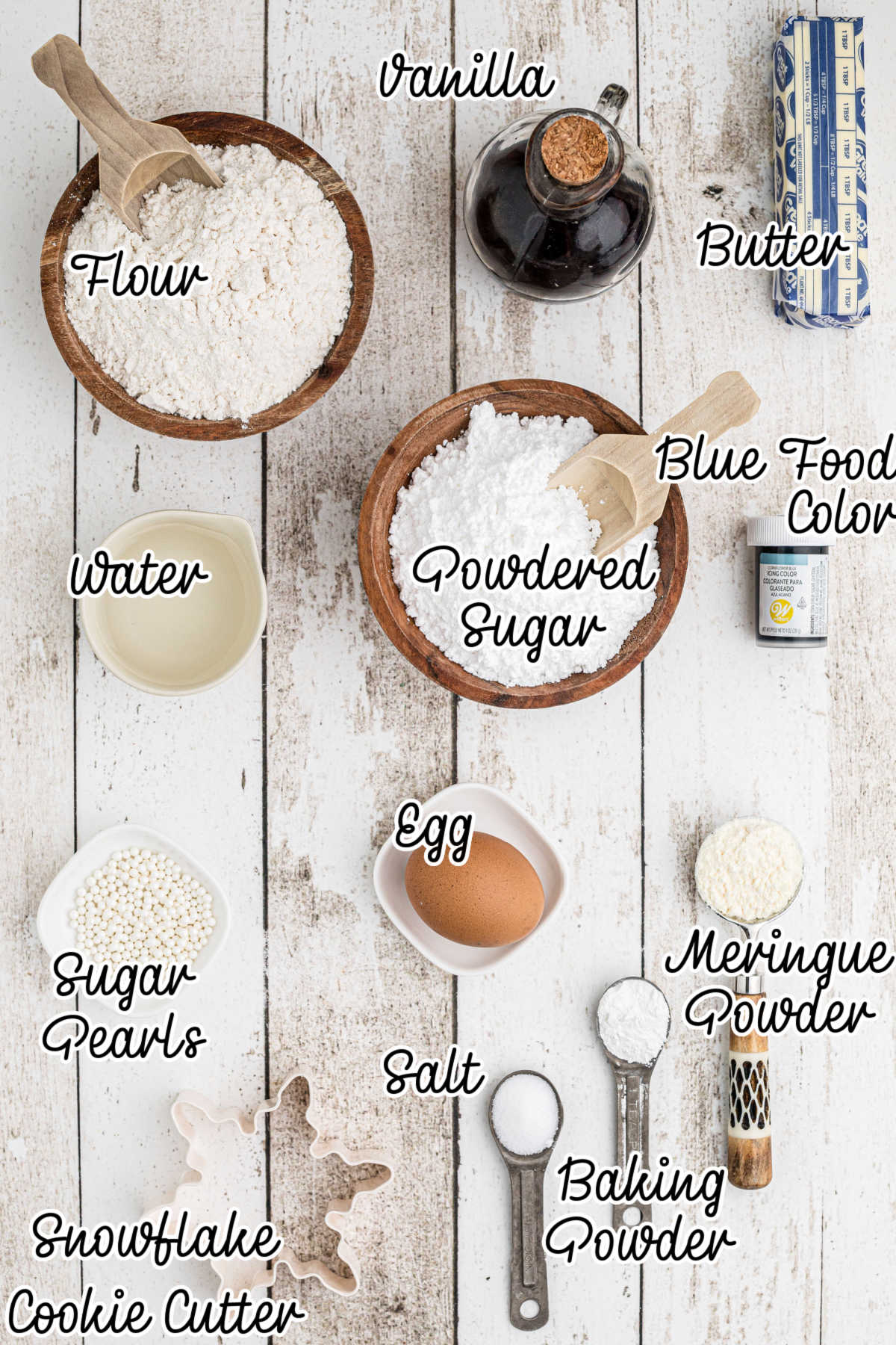 Ingredients needed to make snowflake cookies with text overlay.