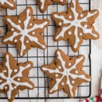 Close up image of some snowflake gingerbread cookies cropped square.