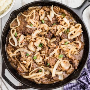 Cast iron pan full of liver and onions.