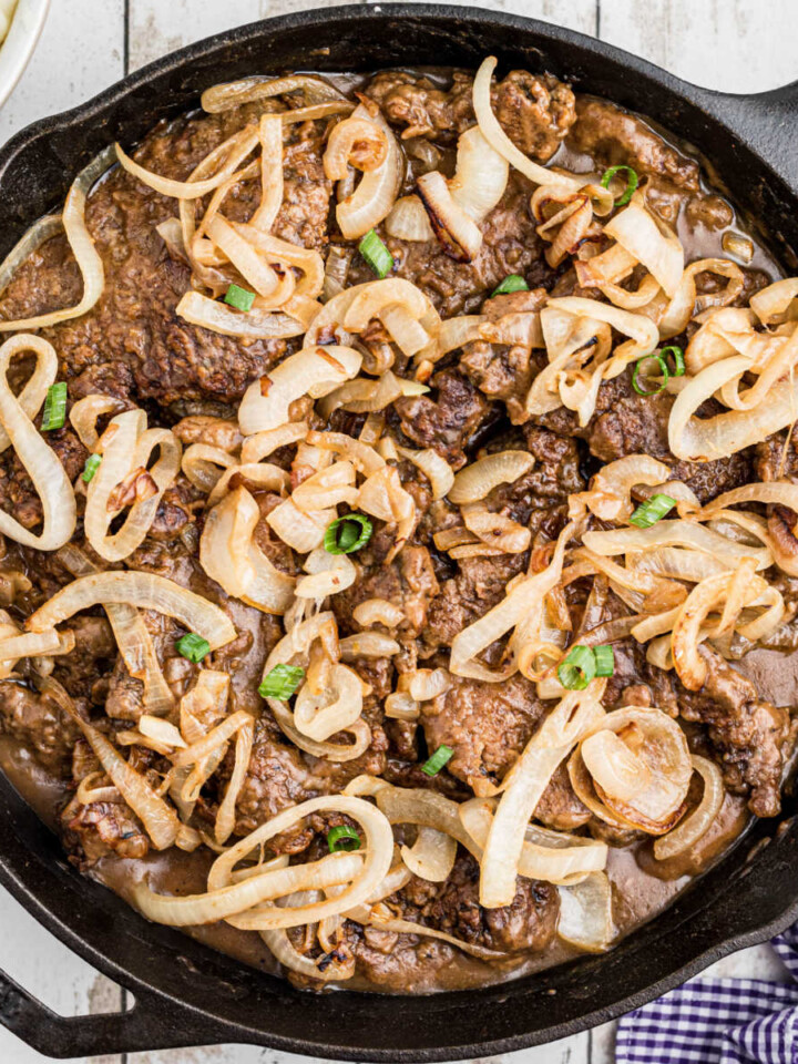 Cast iron pan full of liver and onions.
