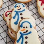 A stack of Starbucks snowman cookies with one up front.
