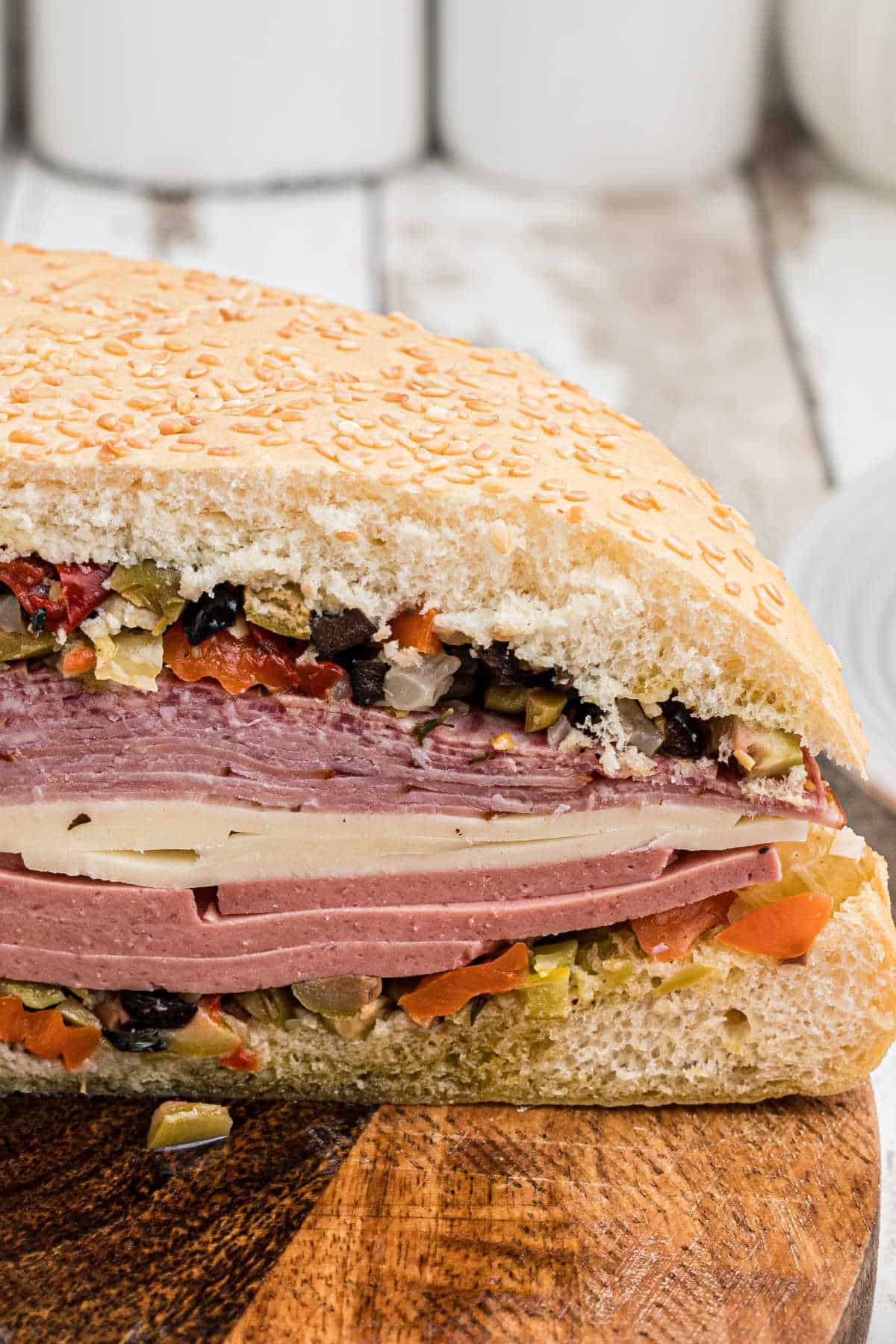 https://thecaglediaries.com/wp-content/uploads/2022/12/Cajun-Muffuletta-Sandwich-Hero-3.jpg