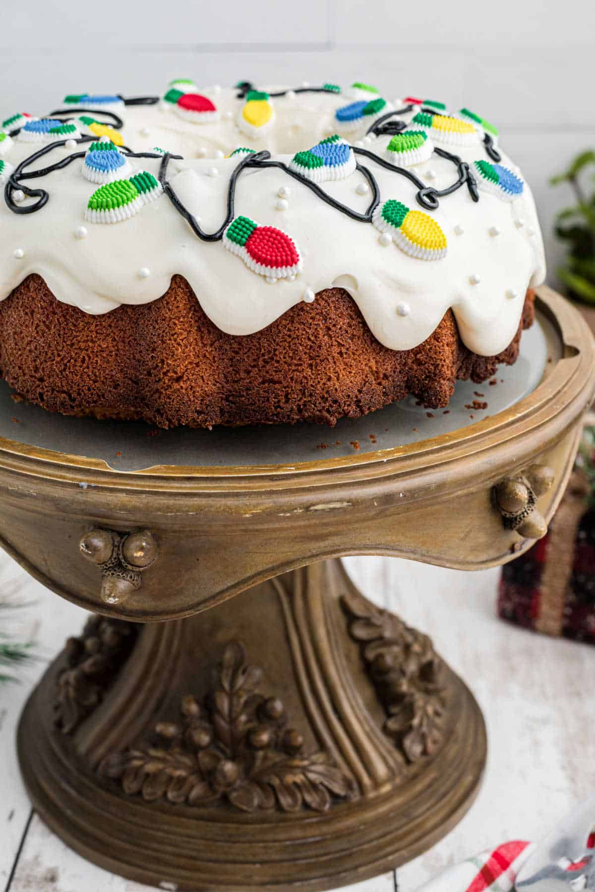 Side view of a Christmas bundt cake on a cake stand.