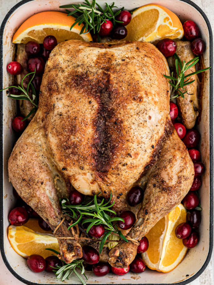 Overhead shot of a Christmas roast chicken, cropped square.
