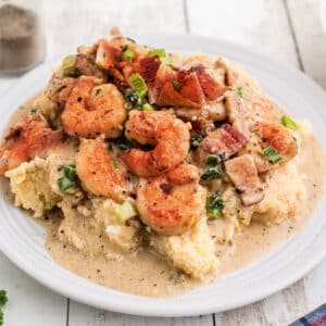 Shrimp and grits with some delicious bacon and green onions sprinkled on top.