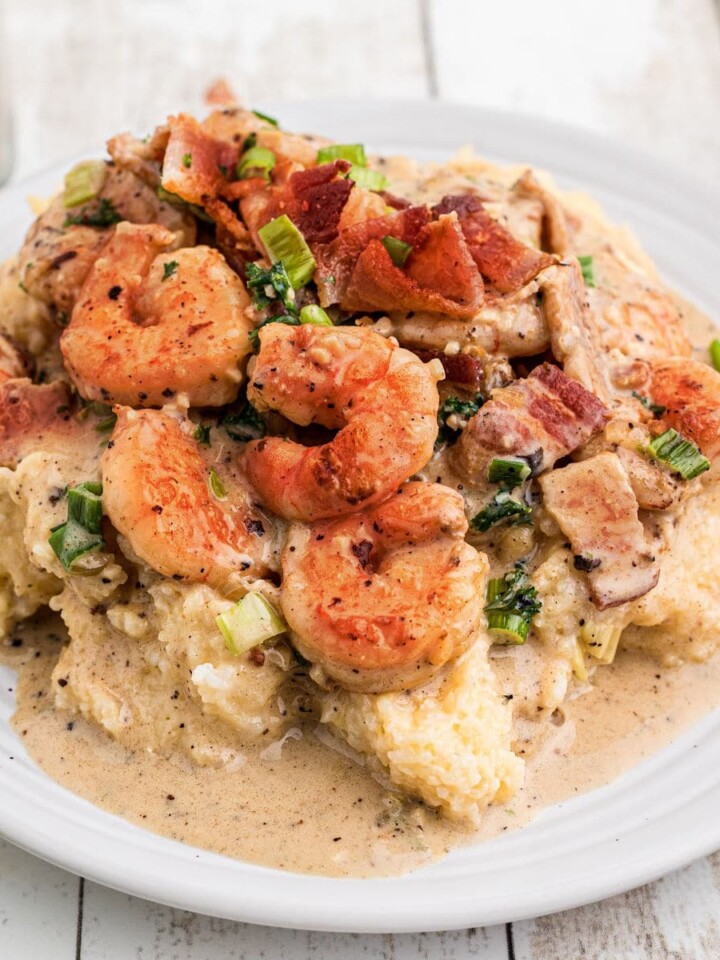 Shrimp and grits with some delicious bacon and green onions sprinkled on top.