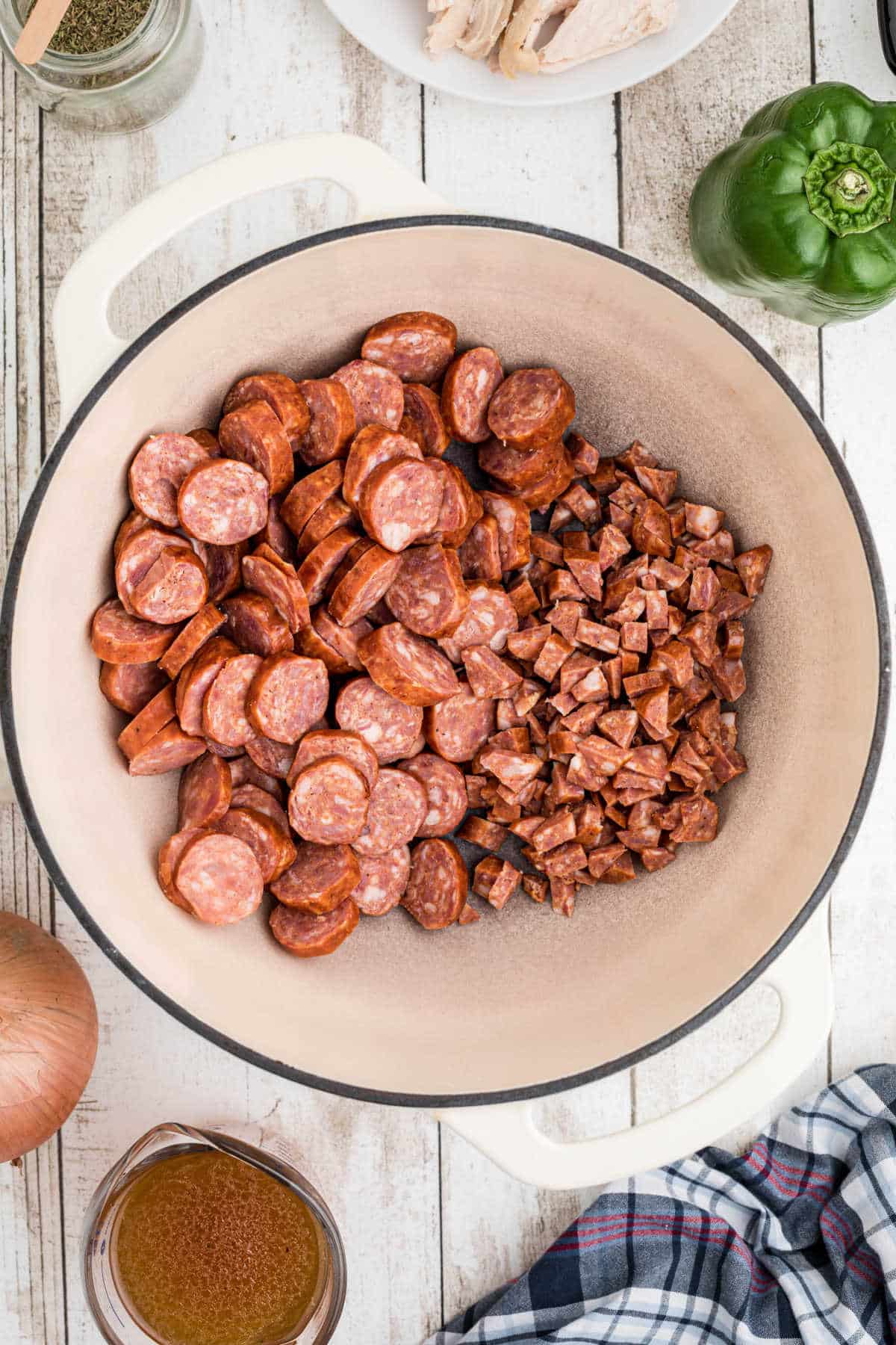 Chopped up smoked sausages in a Dutch Oven.