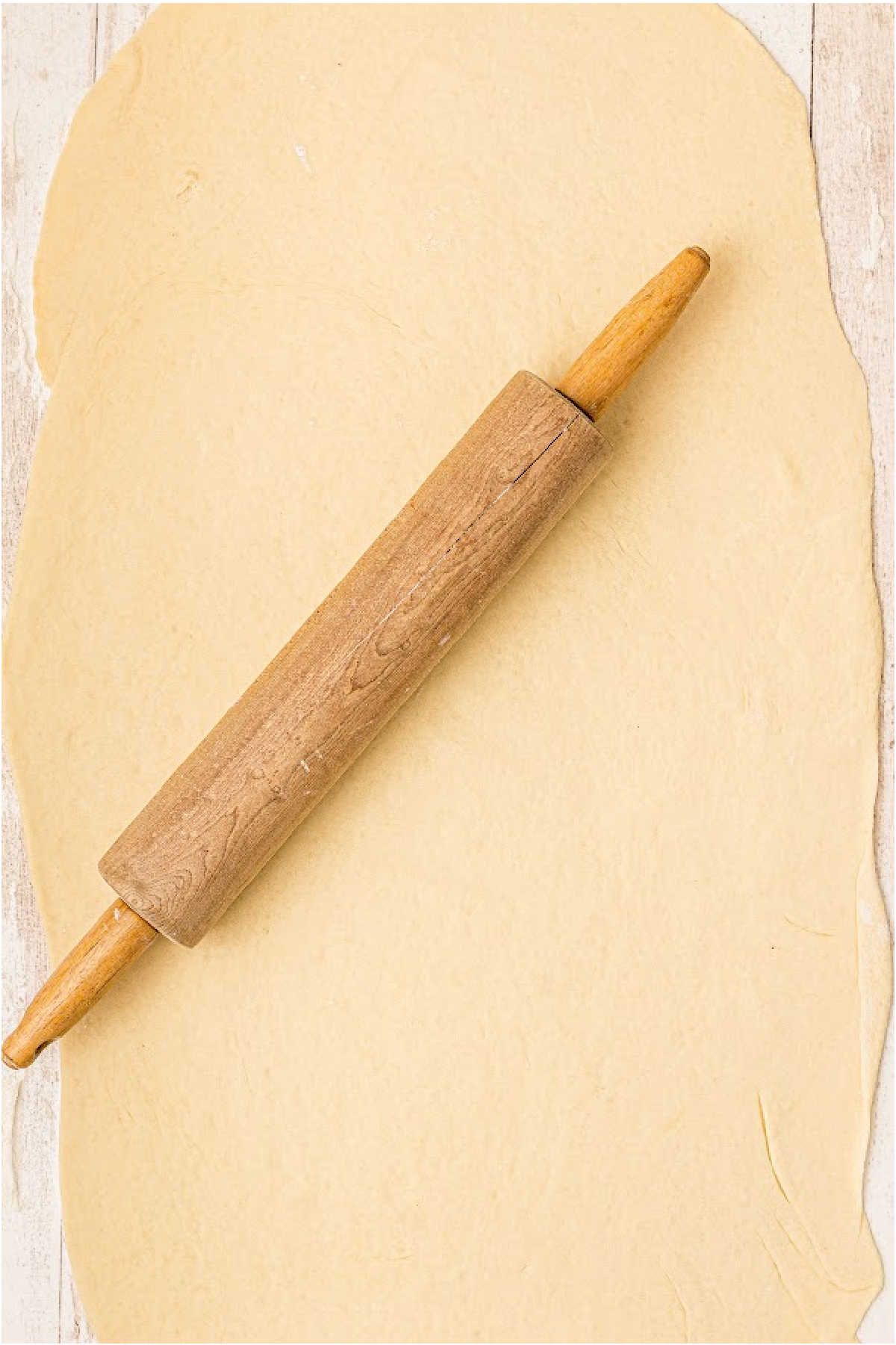Dough rolled out with a rolling pin.