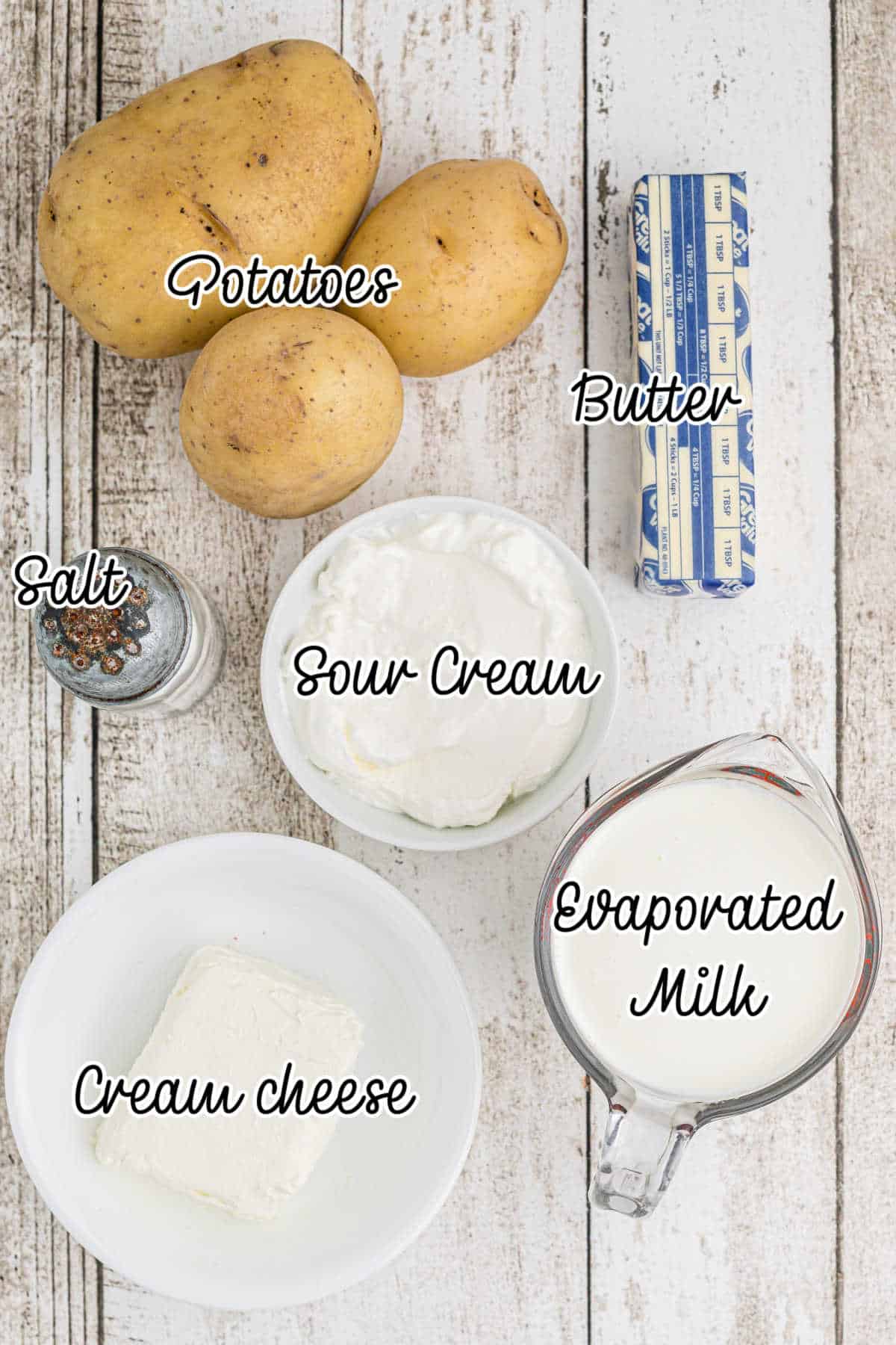 Ingredients laid out for what is needed to make amish mashed potatoes.