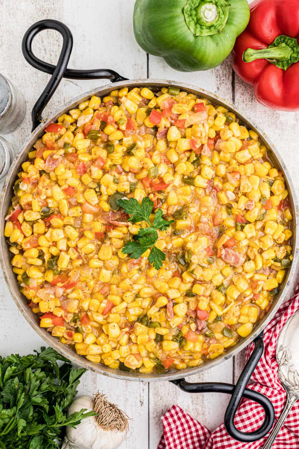 Overhead shot of a skillet with cajun corn maque choux.