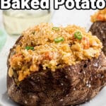 Close up of a baked potato filled with a crawfish filling with text overlay.