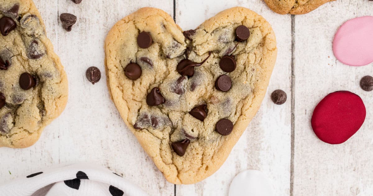 Overhead shot of a heart shaped chocolate chip cookie.