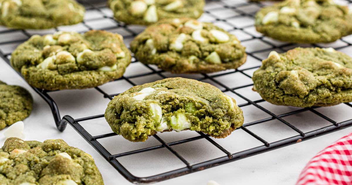 Close up of matcha cookies one with a bite taken out.