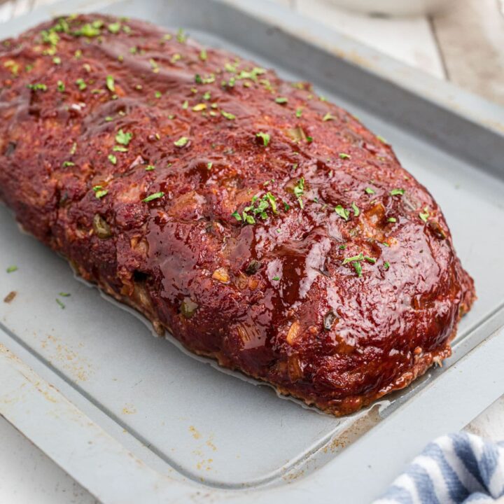 A smoked meatloaf on a pan.