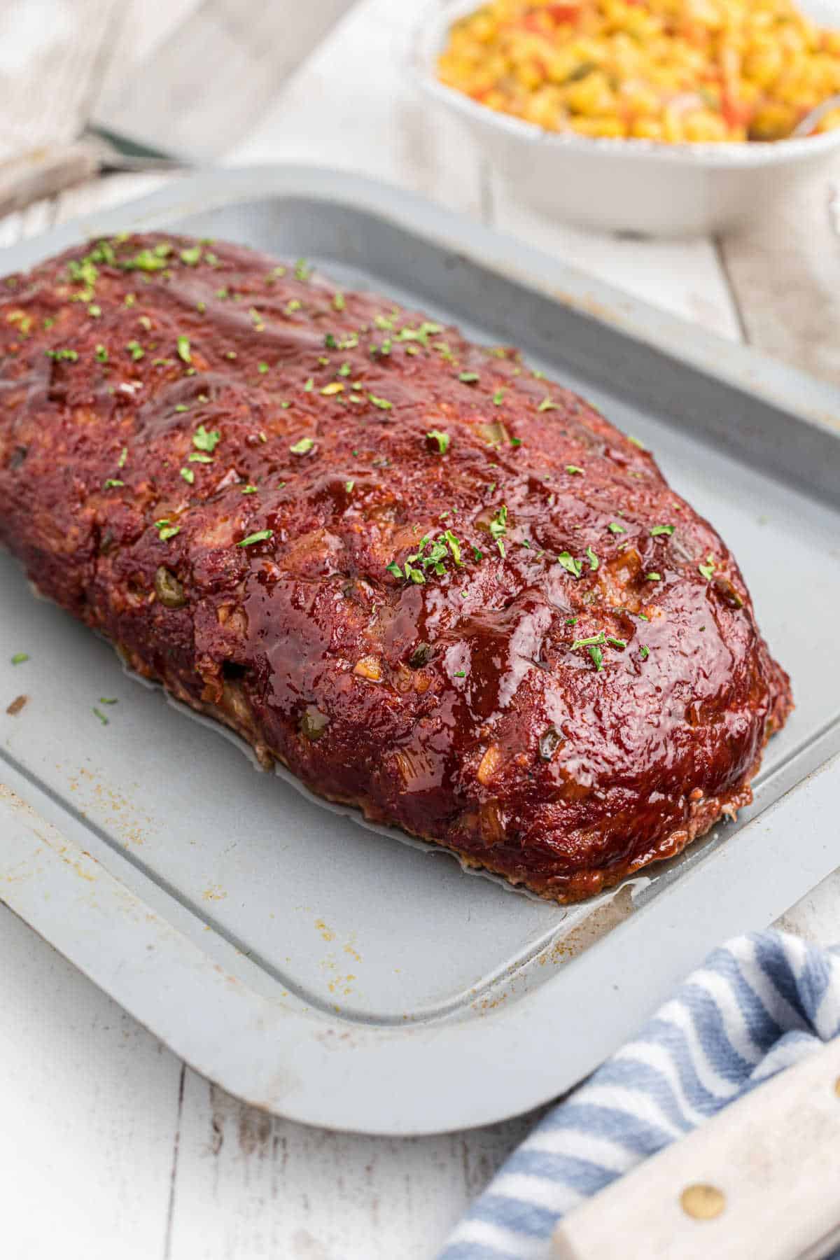 A pan with a smoked meatloaf fresh off the smoker.