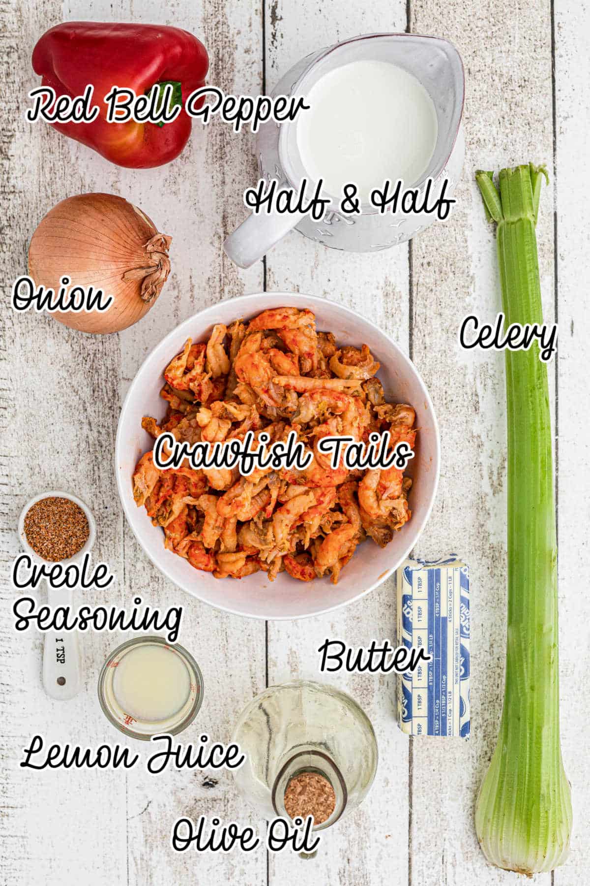 Ingredients laid out with text overlay, showing what is used to make a crawfish sauce.