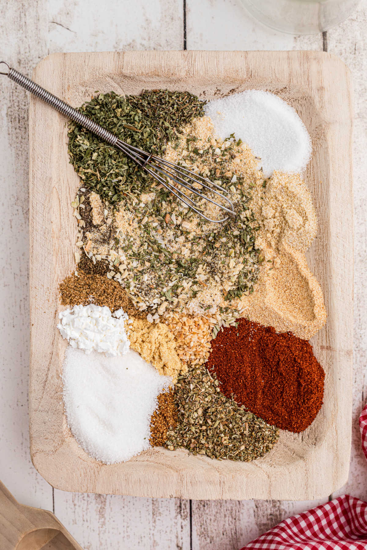 Overhead shot of a wooden container with seasoning about to be mixed up.