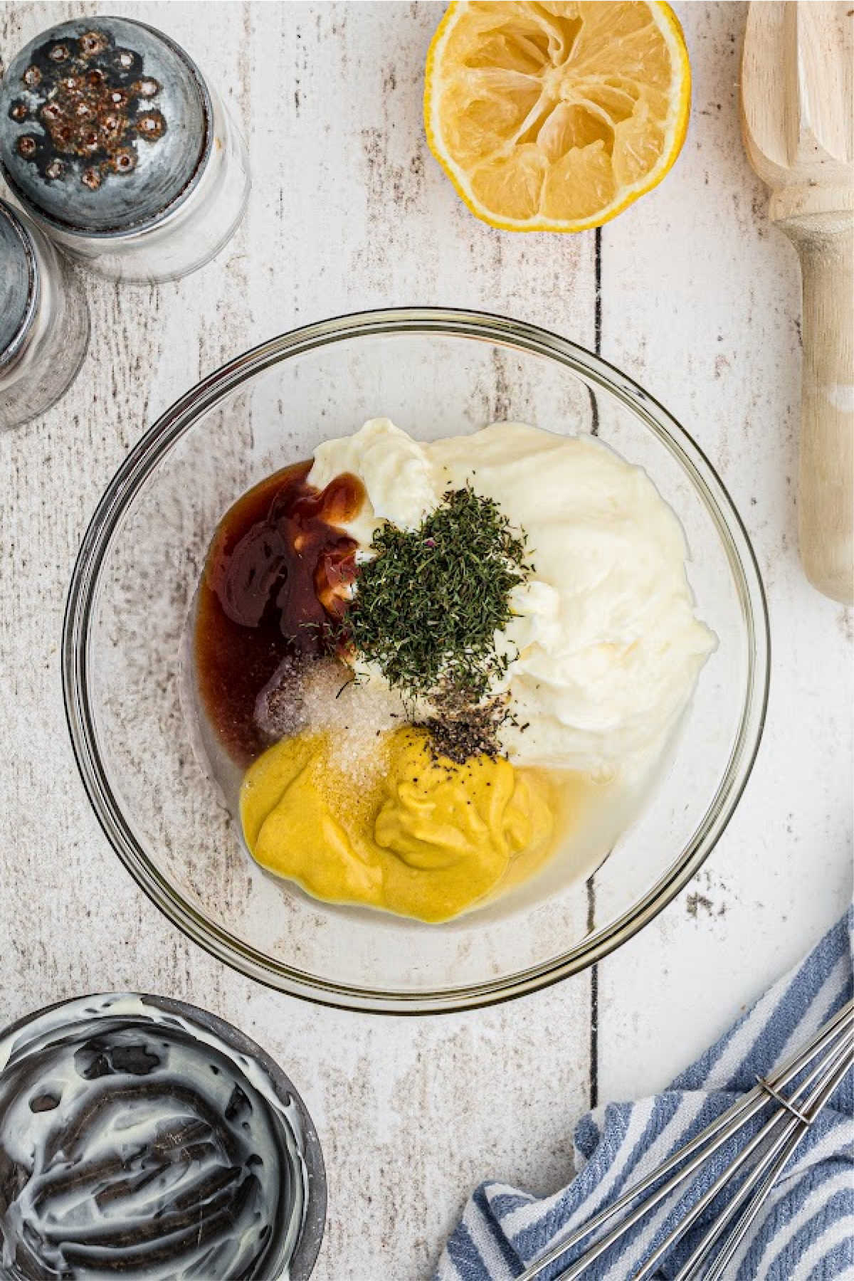 A small glass bowl full of sauce ingredients.