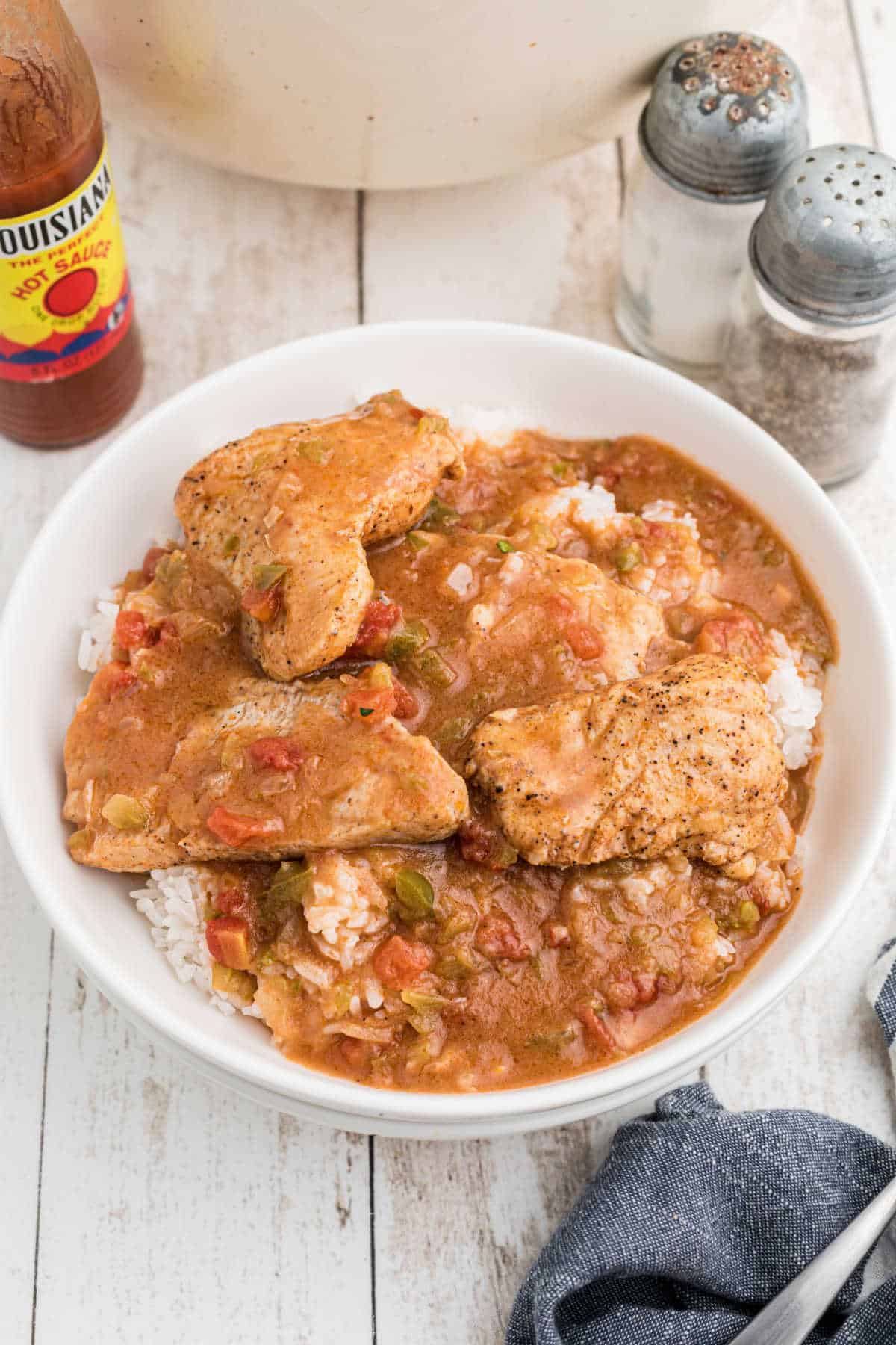 Overhead shot of a bowl of catfish courtbouillon over rice.