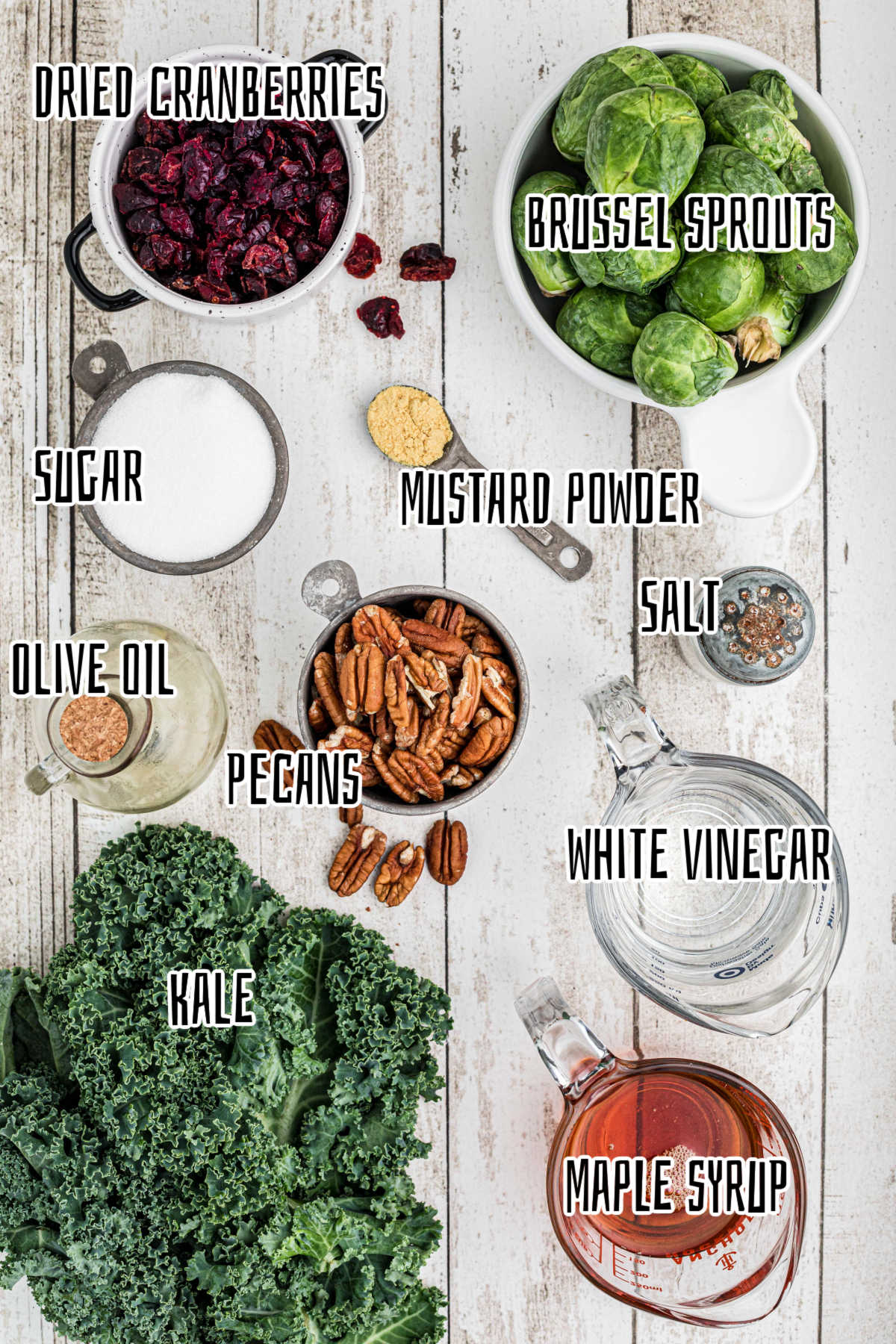 Overhead shot of ingredients needed to make a cracker barrel kale salad, with text overlay.