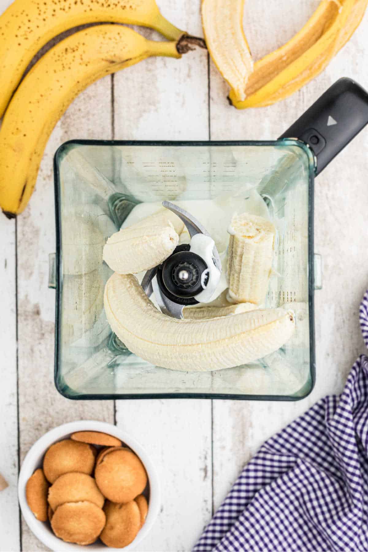 Bananas in a blender, about to be blended.