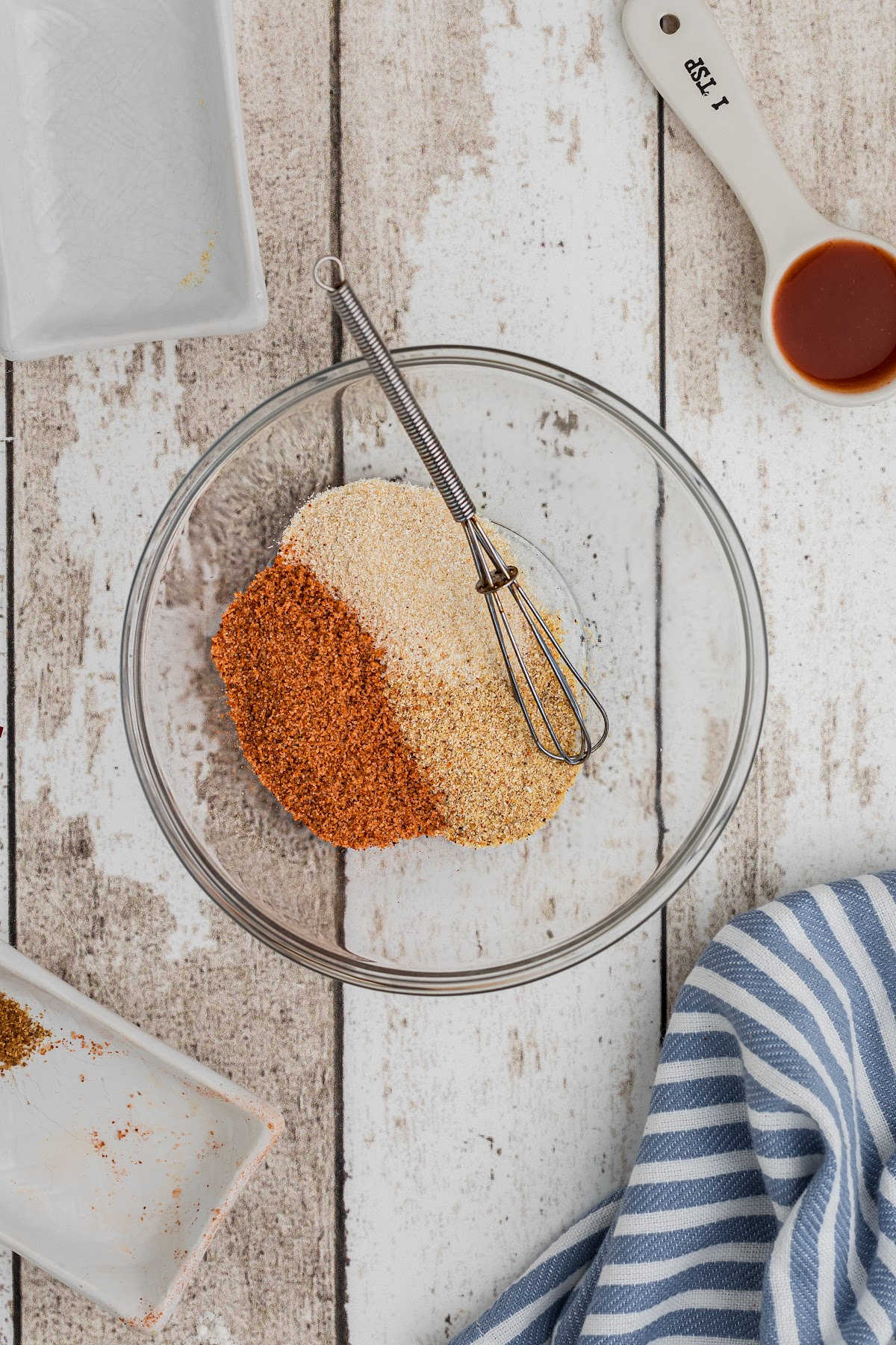 A small mixing bowl with a tiny whisk.