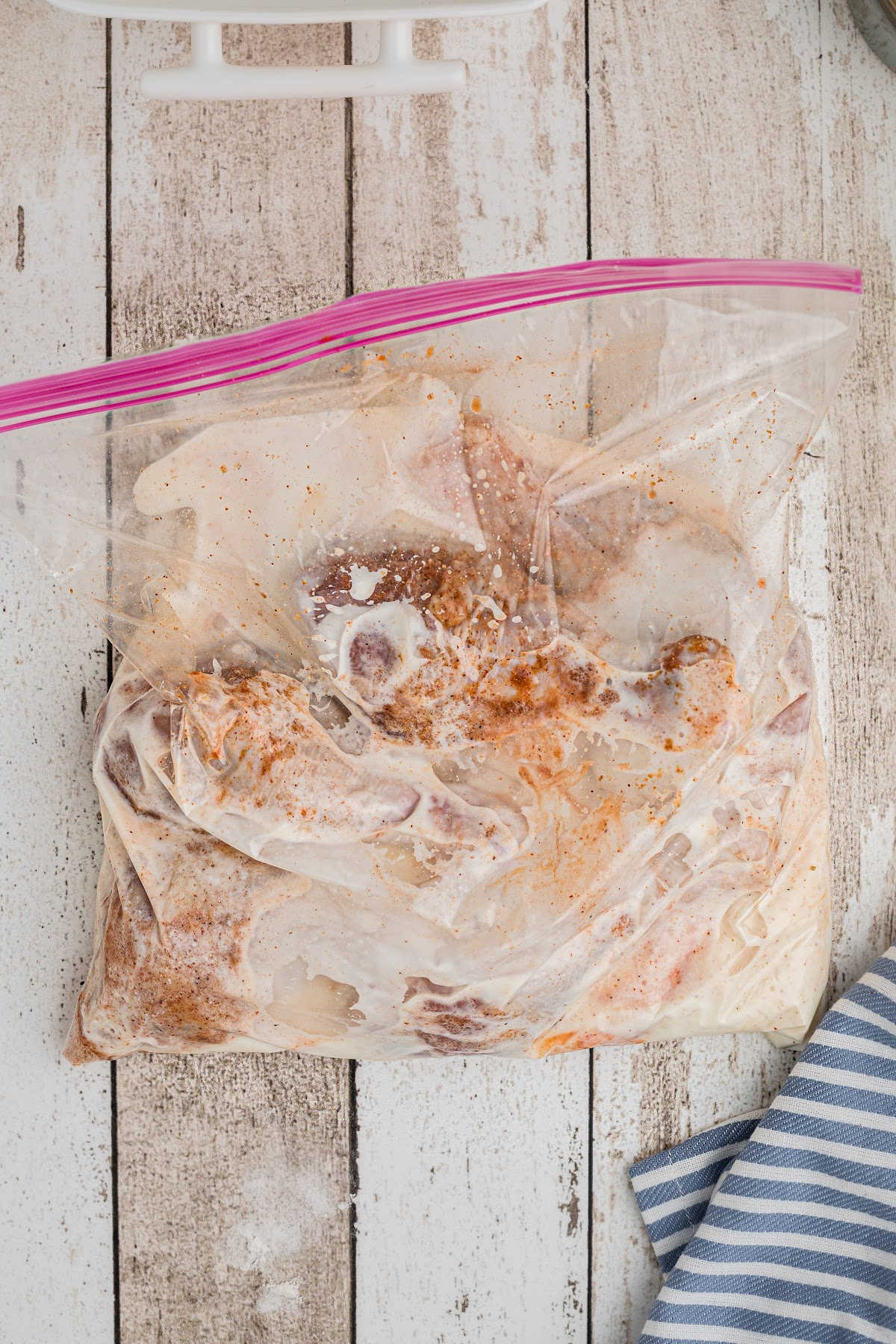 Buttermilk and chicken in a resealable bag.