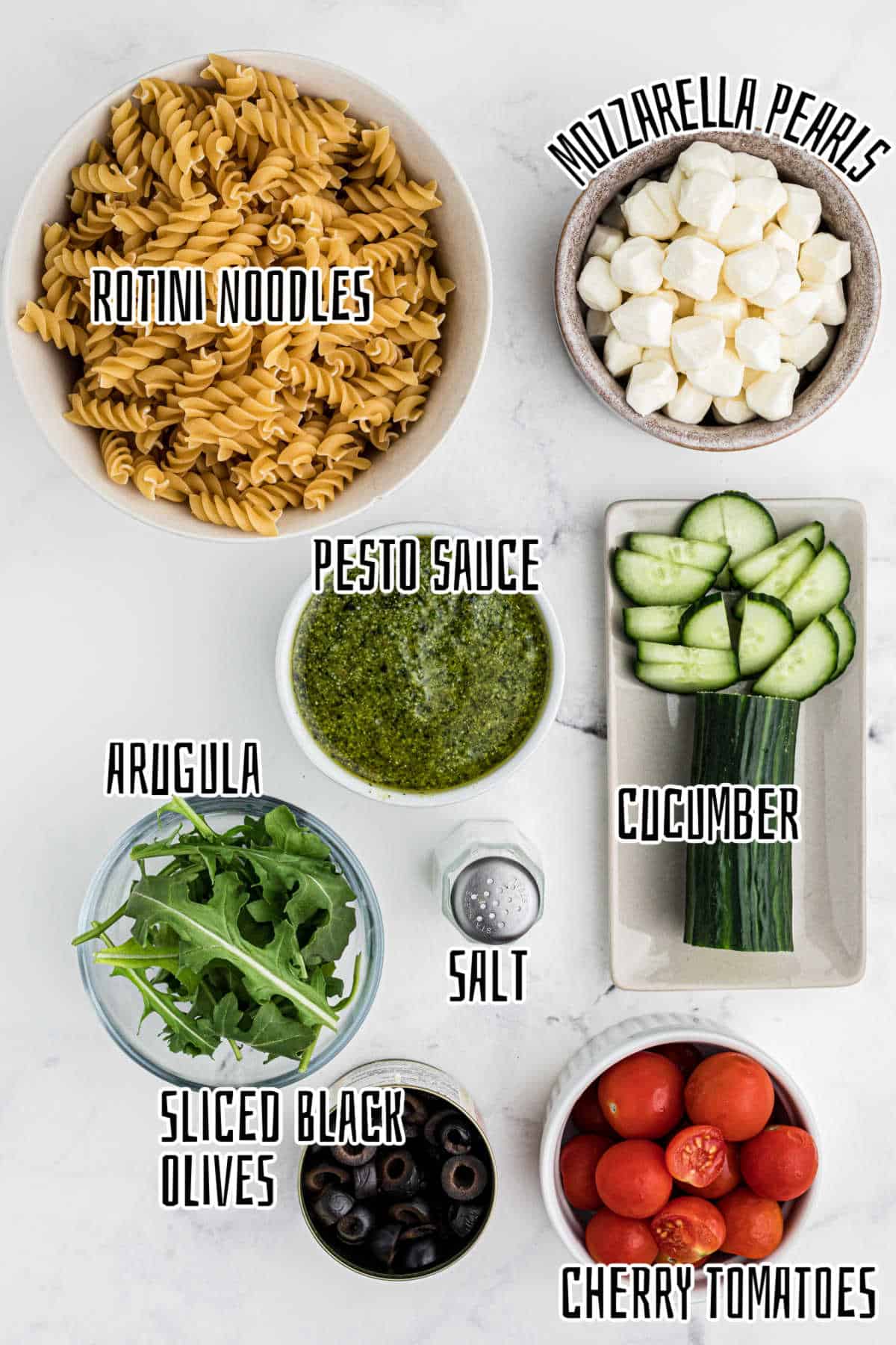Ingredients needed to make a pesto pasta salad.
