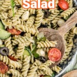 Close up shot of a bowl of summer pesto pasta salad with text overlay for pinterest.