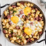 Overhead and cropped square, a skillet with a traditional Irish corned beef hash recipe.