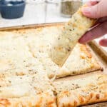 Italian Cheese Bread image with one being picked up with text overlay for pinterest.
