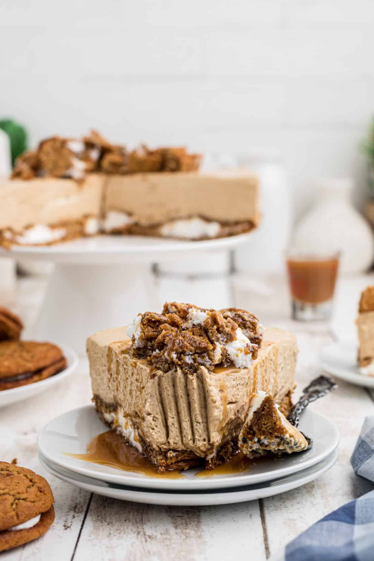 A slice of oatmeal creme pie cheesecake with a fork mark through the front.