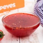 Close up of a bowl of popeyes sweet heat sauce recipe.