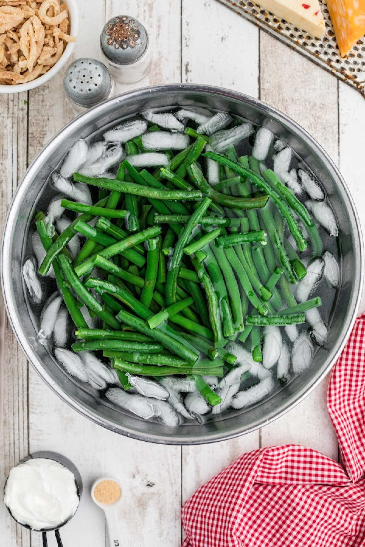 Green beans in a pot with ice.